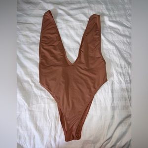 Dippin Daisy’s low cut, high leg, Swimsuit